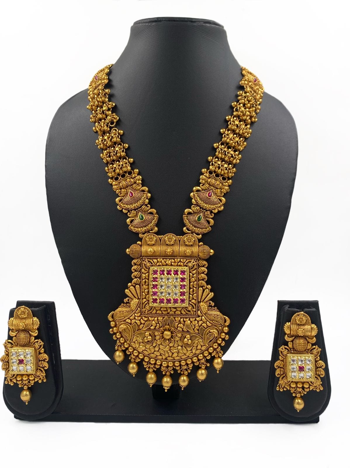 http://gehnashop.com/cdn/shop/files/royal-look-gold-plated-antique-golden-long-necklace-set-for-weddings-by-gehna-shop-gehna-shop-gold-necklace-set-designs-for-weddings-buy-online-41753697059131.jpg?v=1687984932