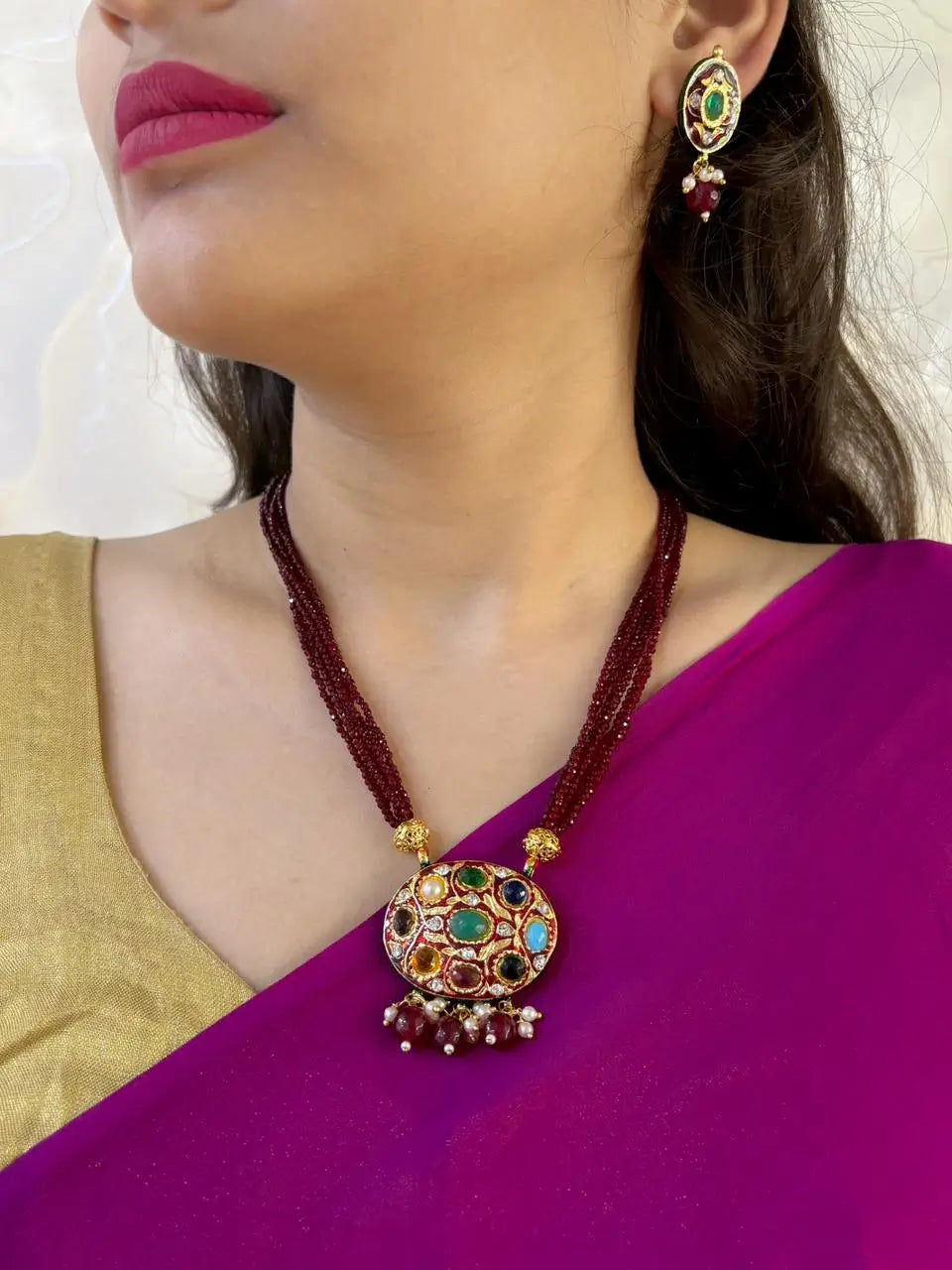Traditional Gold Plated Multi Color Navratna Pendant Necklace Set With Layered Maroon Hydro Beads 