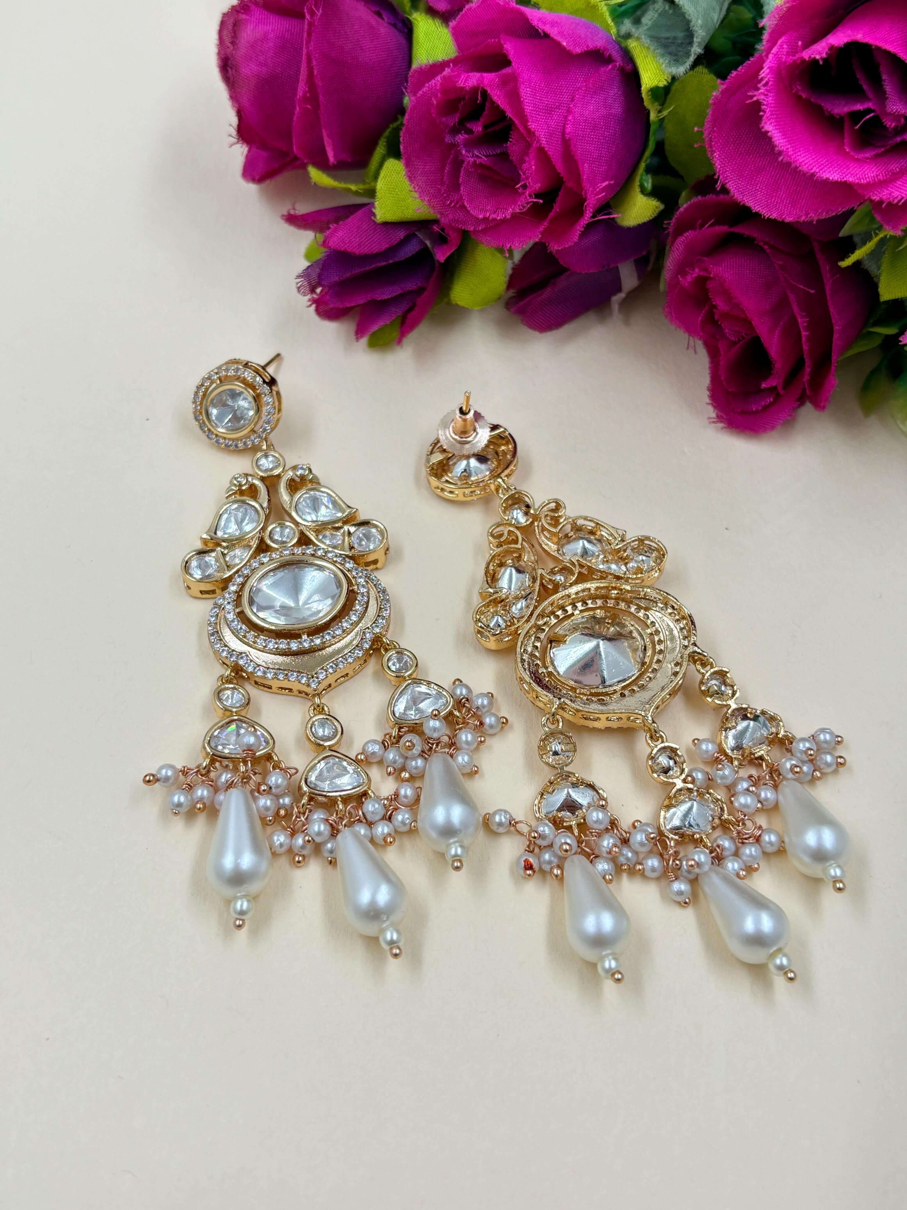 Designer Modern Look Long Kundan Polki Dangler Earrings with Studded polki and Ad stones with carat plating . Handcrated for both Indian and Western wear 