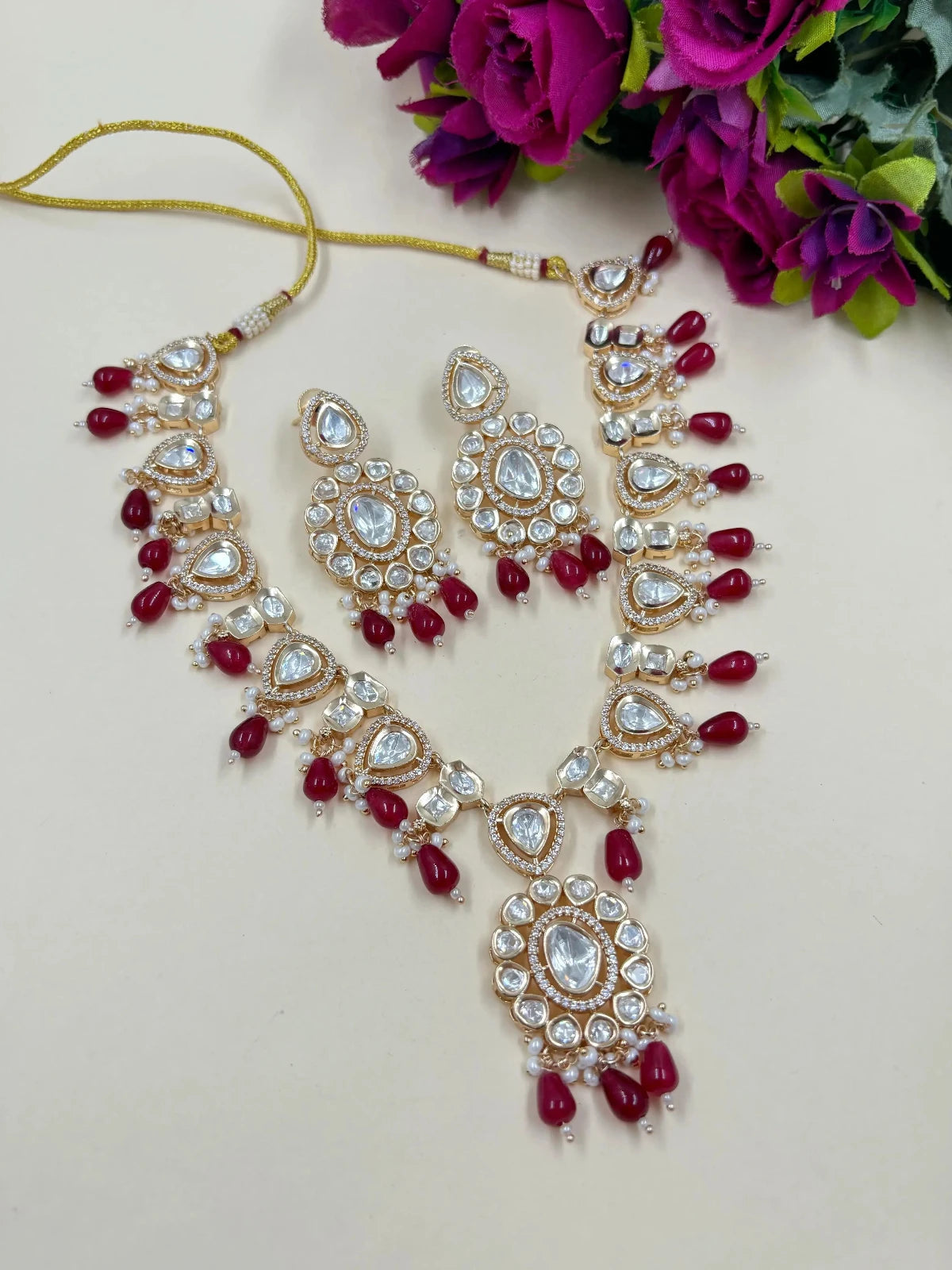 Anisha Rose Gold Finish Polki Kundan Jewellery Necklace Set with ruby red Beads Drops 