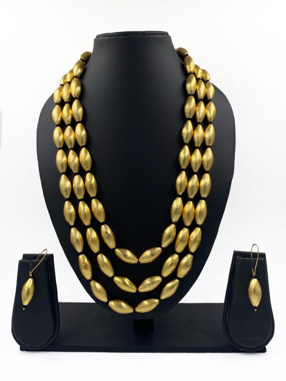 Triple Layered Handcrafted Gold Toned Dholki Beads Necklace Set By Gehna Shop Golden Beads Jewellery
